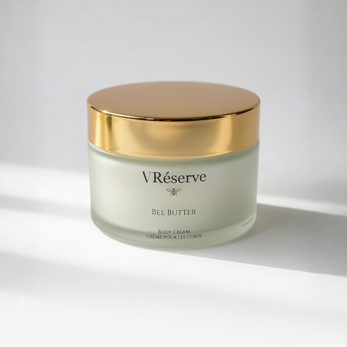 Jar of V Reserve Bee Butter Body Cream with gold lid on a white background