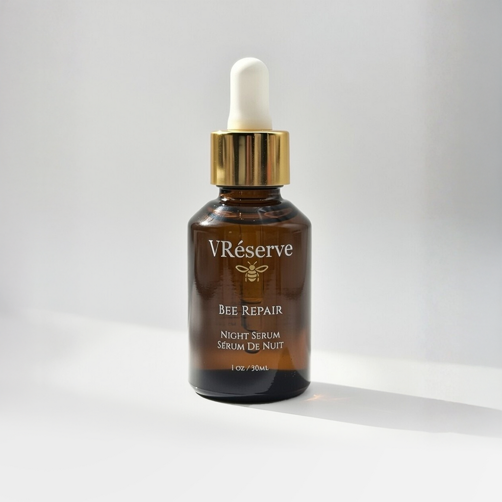 V Reserve Bee Repair night serum bottle with dropper on a light gray background