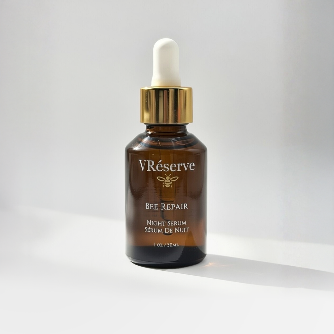 V Reserve Bee Repair night serum bottle with dropper on a light gray background